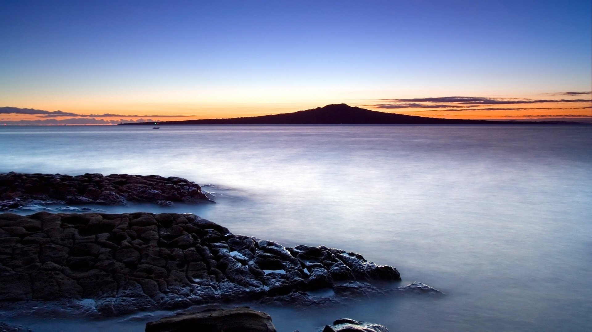 rocky shore haze water