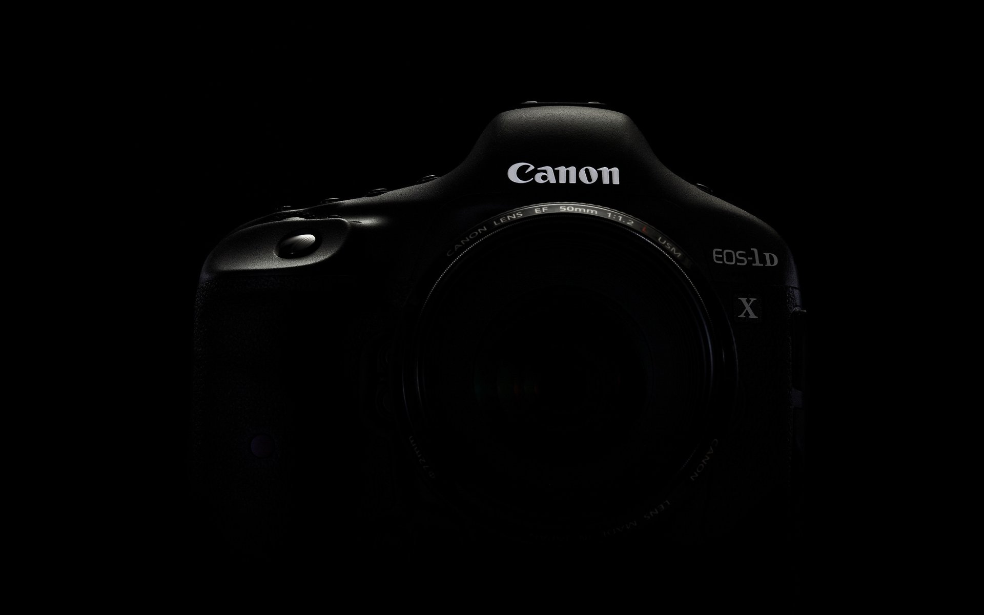 a camera canon 1dx black background