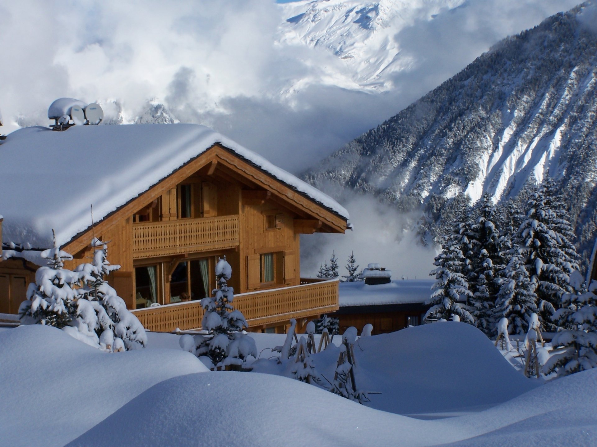 winter holidays a house made of wood snow mountains winter frost the snow tree forest the wind nature house