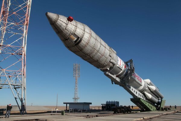 Cosmodrome with a rocket carrier against a clear sky