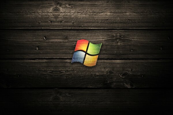 Logo di Microsoft su sfondo di legno