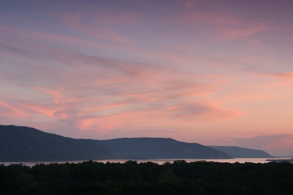 Nature pink sky, cotton clouds, mountains, hills, sunset, forest, lake, smooth surface