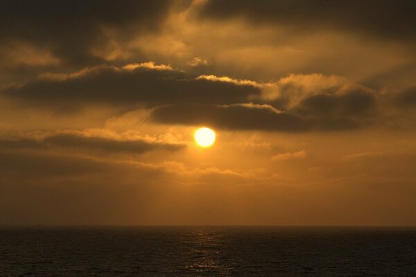 Orange sunset and dark clouds