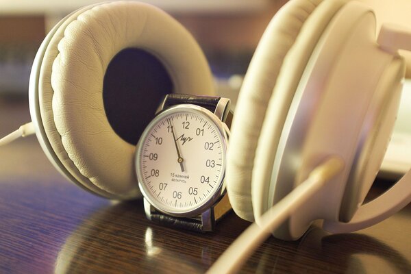 Vintage watches and headphones on the table