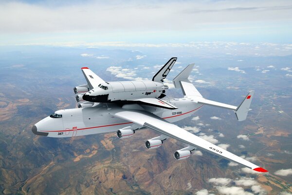 A large plane carries a small plane on itself