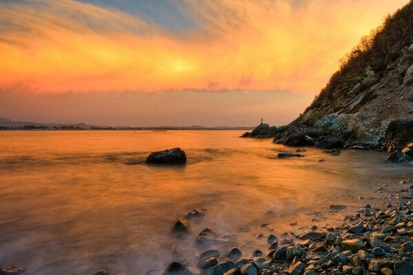 Orange sky over water in nature