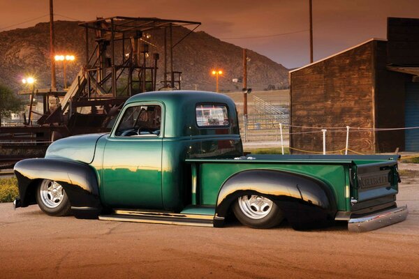 Classic green truck in the parking lot