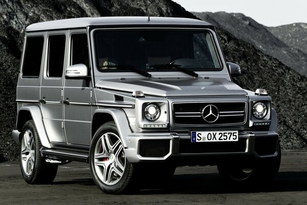 Silver jeep in the atmosphere of the mountains