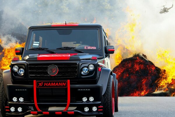 A black car on the background of an explosion