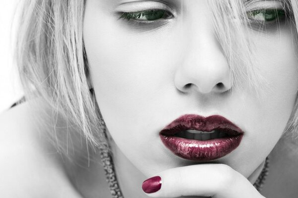 Scarlett Johansson in black and white with bright lips and nails