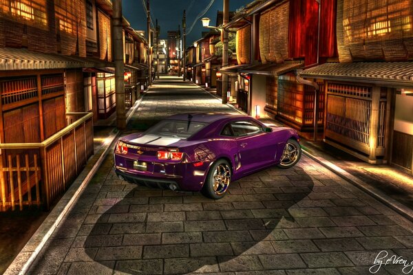 An eggplant-colored sports car on an urban background