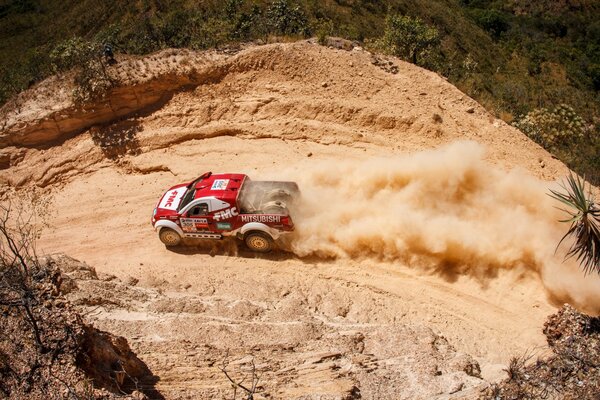 4x4 SUV moves through a sandy quarry