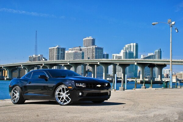 Chevrolet camaro ss on the background of the metropolis