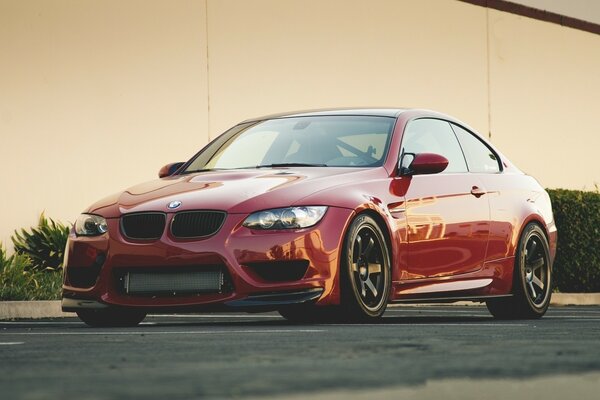 Red BMW on a green background