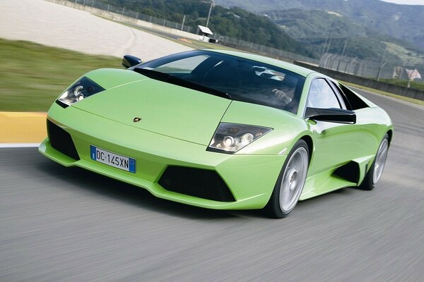 Green Lamborghini Murcielago on the highway