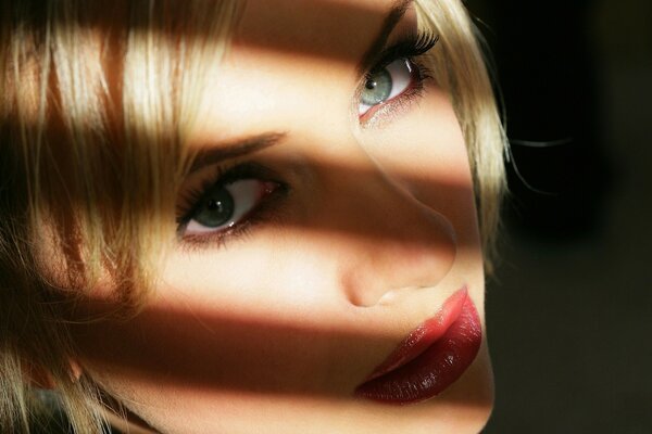 Shadow on the face of a spectacular blonde