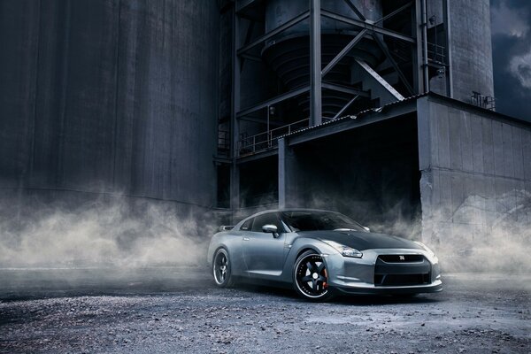 Nissan drifts on gravel and creates dusty clouds