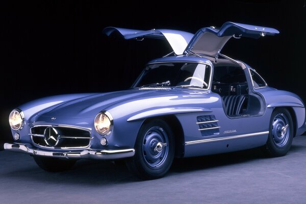 Classic Mercedes blue car with doors up