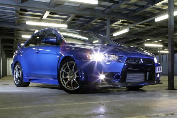 Stylish blue sedan in the parking lot