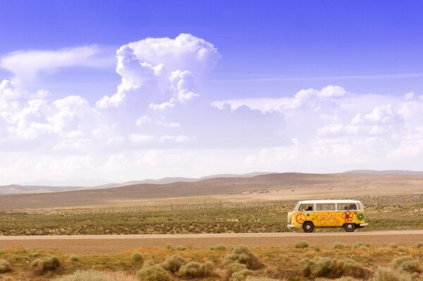 A lonely bus in the steppe. Amazing clouds