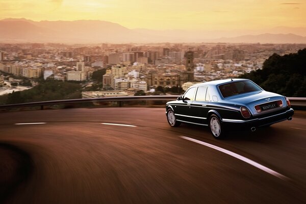 A flying Bentley on a sunset highway