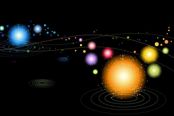 Sfere di diverse dimensioni e colori su sfondo nero