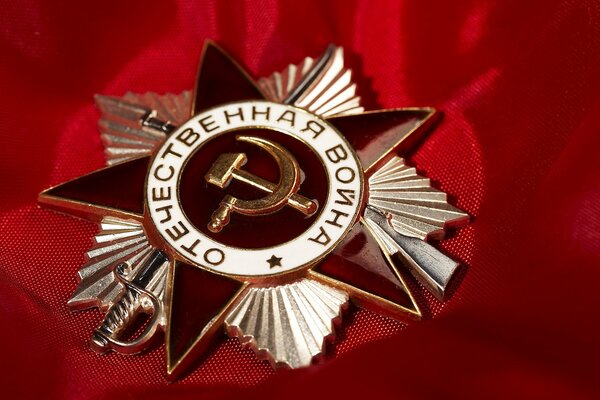 Red star Soviet badge on red cloth