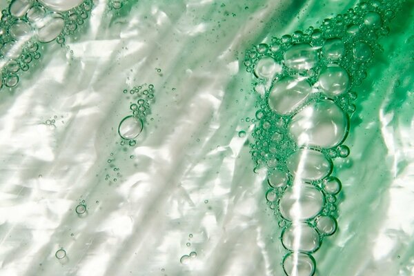 Green bubbles on a white background