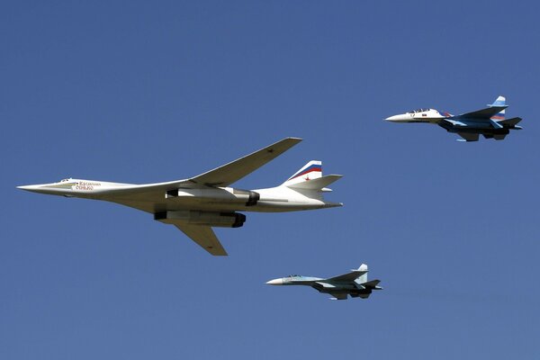 Two fighters accompany the Tu-160 aircraft