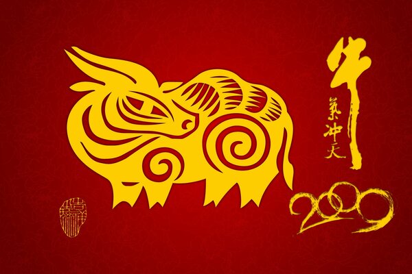 The symbol of the year is a golden bull on a red background