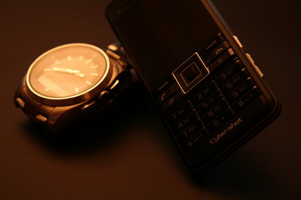 The image of the phone and watch in brown colors