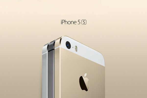 A cell phone in gold and gray tones. Apple