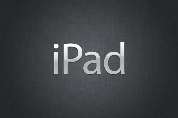 IPad lettere metalliche su sfondo grigio