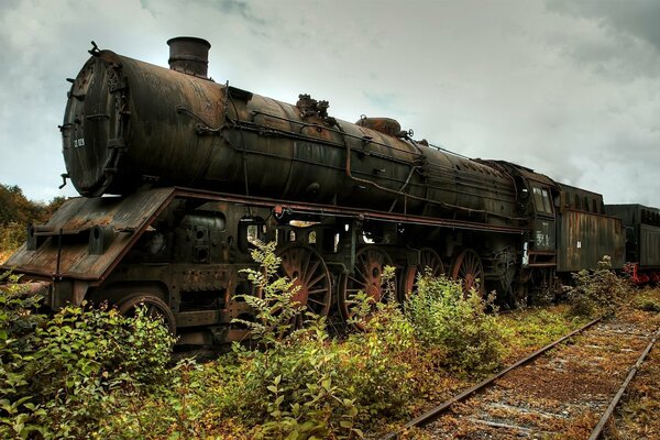 An old train on a dark sky background