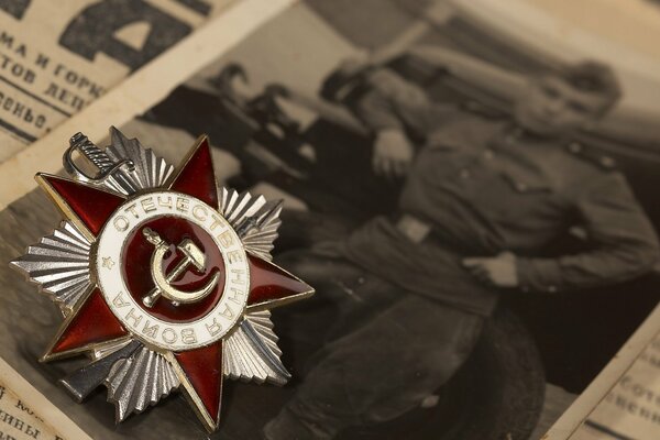 The red star of the hero on a clipping from an old newspaper