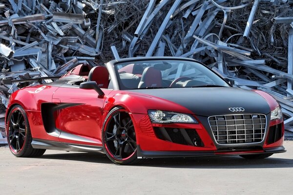 Red audi r8 spyde car on the sand