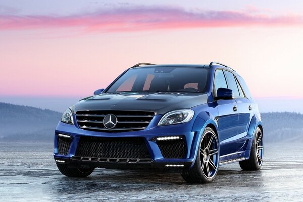 Blue mercedes benz at sunset on the beach