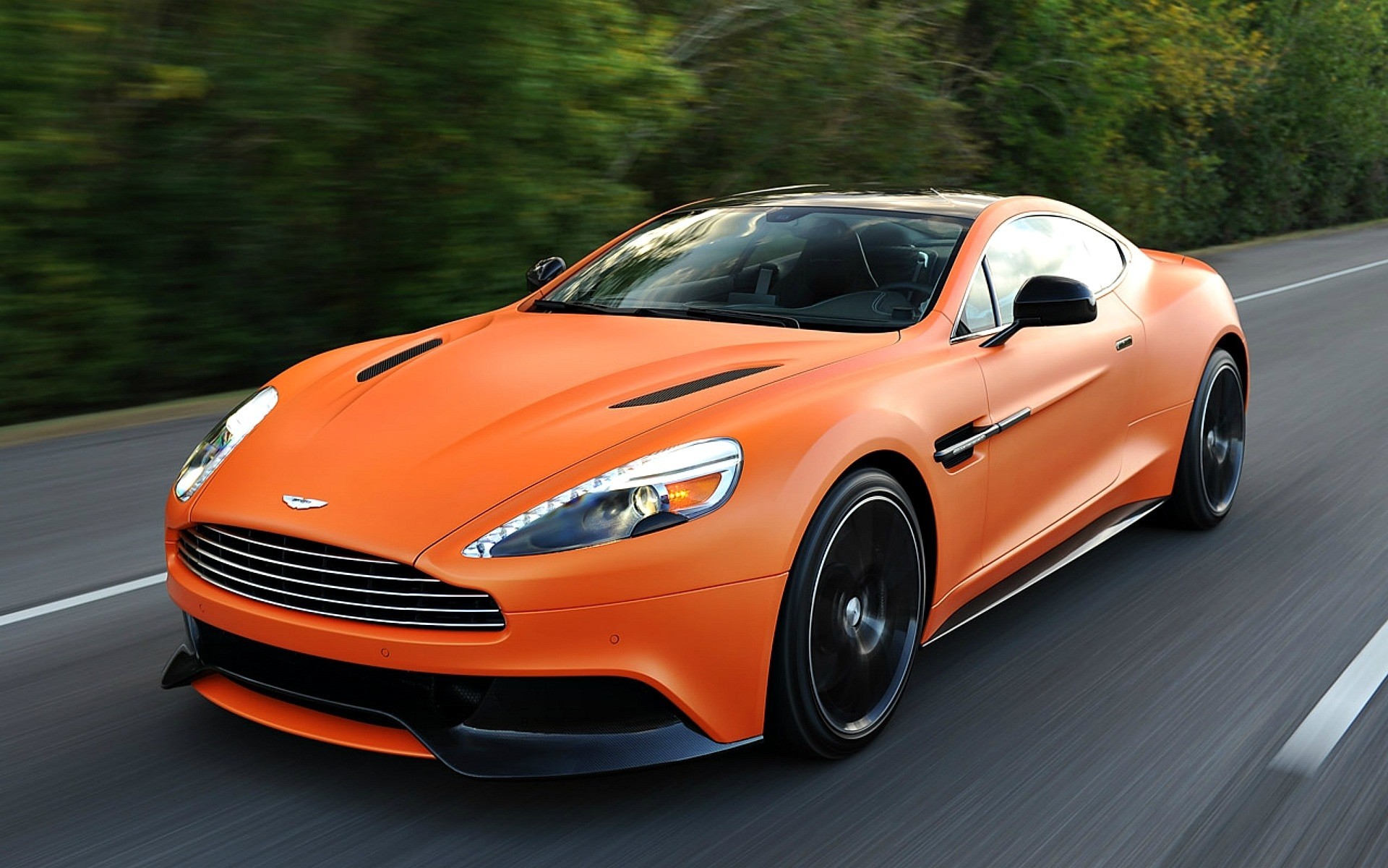 orange aston martin autos