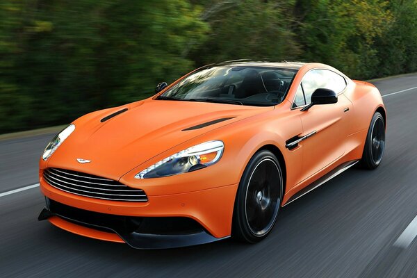 Orange Aston Martin on the road