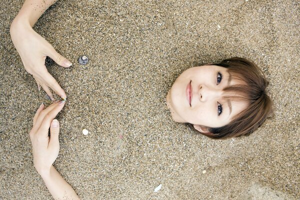 Japanese orihara mika in the sand on the beach