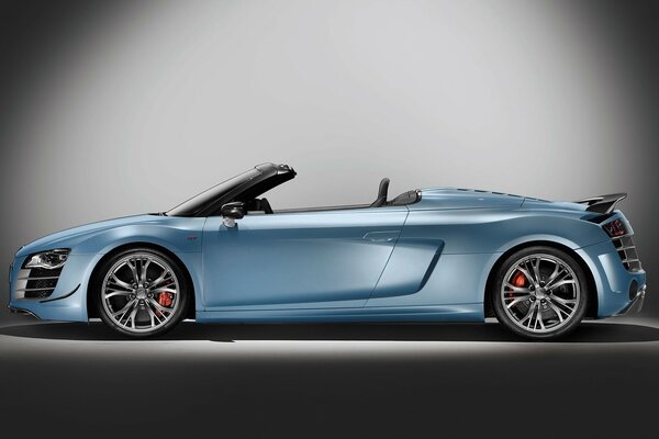 Blue Audi convertible on a gray background