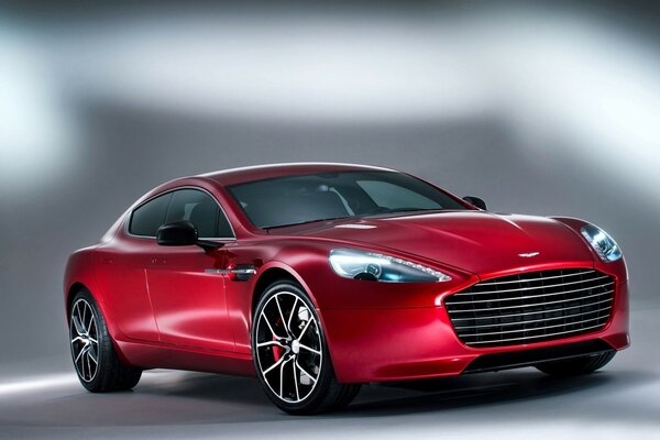 Red aston martin 2014 on a gray-white background