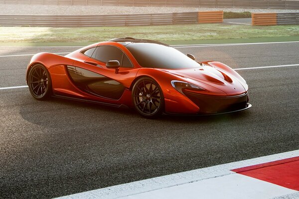 Red McLaren supercar on the track