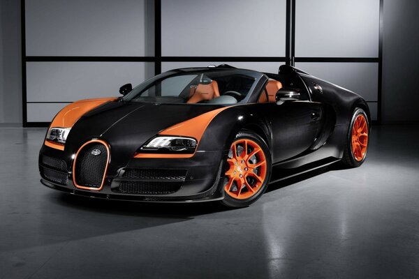 Deportivo Bugatti Veyron negro en Llantas de aleación naranja