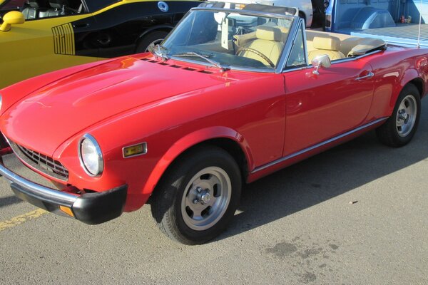 Red retro convertible in the parking lot