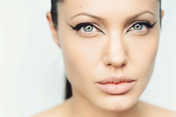 Angelina Jolie with painted arrows on her eyes