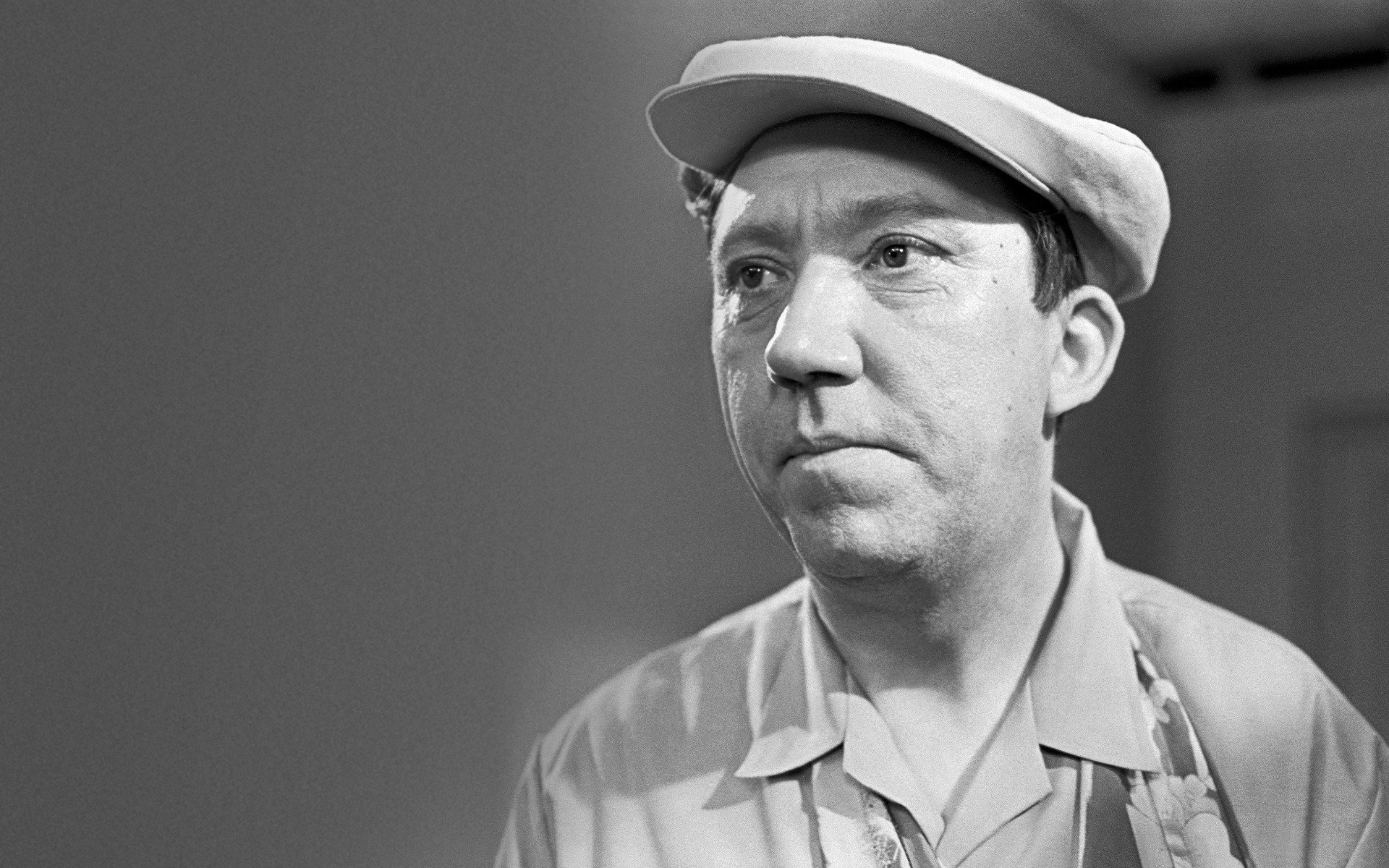 the cap smiling eyes yuri nikulin actor portrait actors look clowns ussr the soviet union past cap grey background eyes face black and white