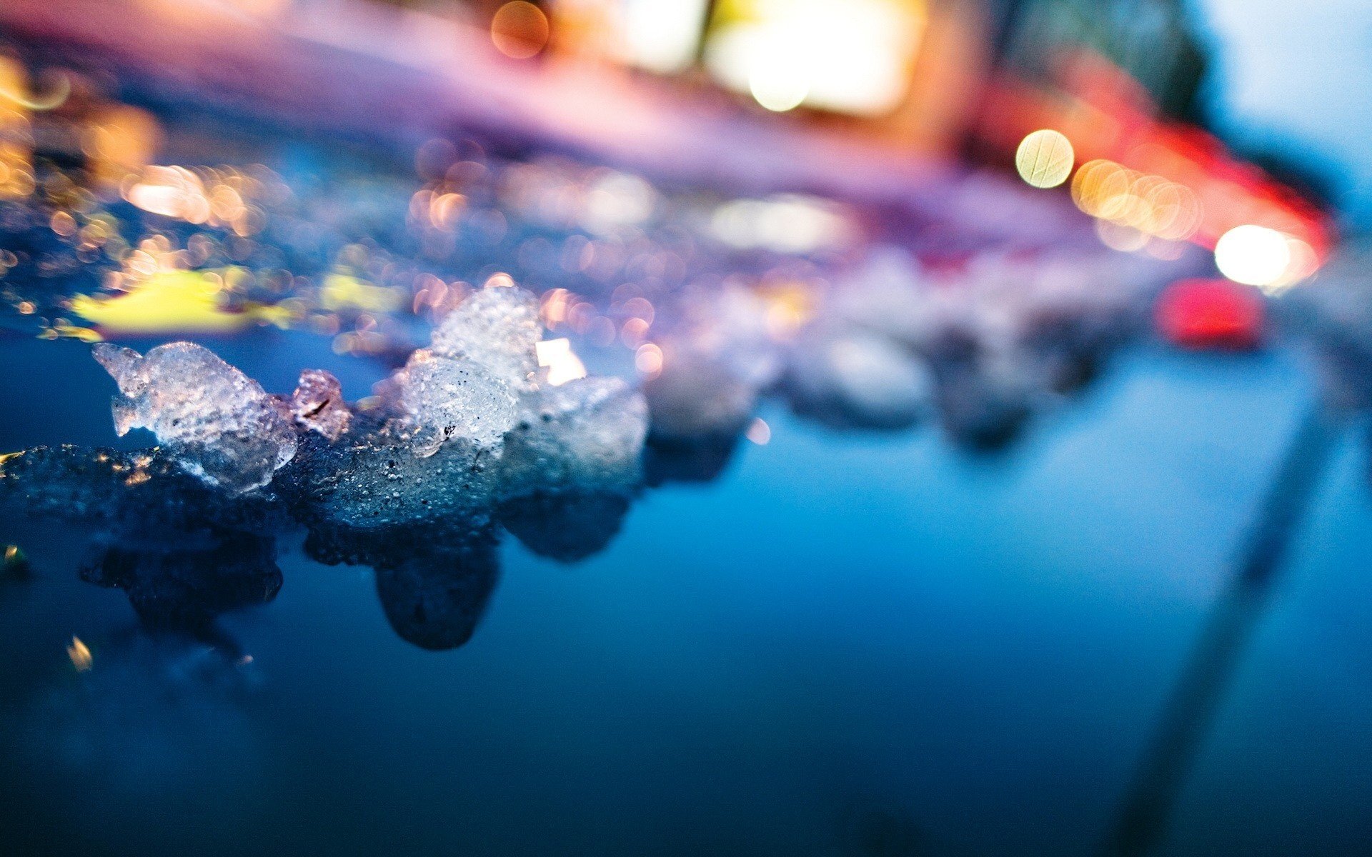 light water ice pieces puddle reflection lights lanterns winter macro photo mood