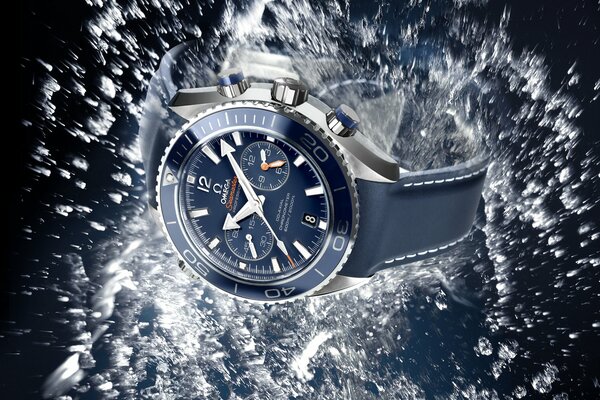 Men s wristwatches among water splashes