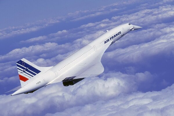 FA-18 plane takes off above white clouds